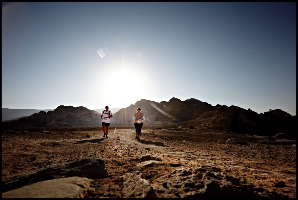 2 Trail runners running a trail marathon through the rocky desert