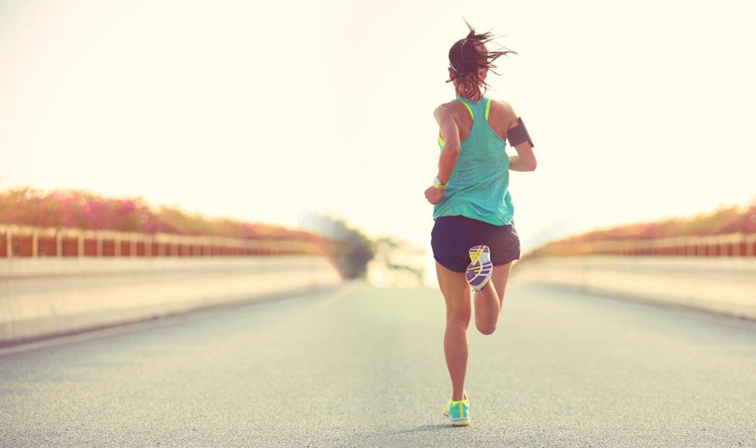 a woman running for Ultramarathon stretch
