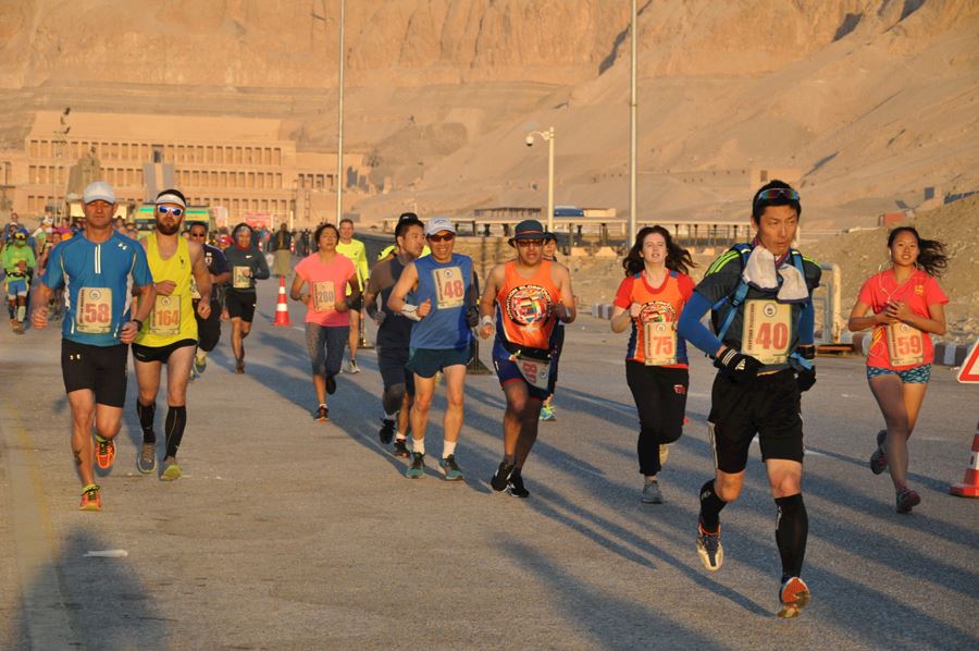 Runners running the Egyptian marathon in Luxor