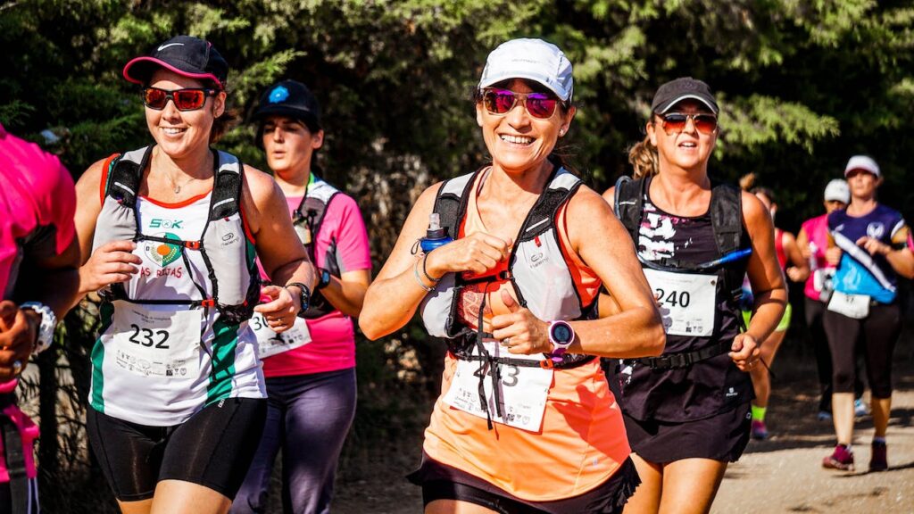 women running a race with running sunglasses